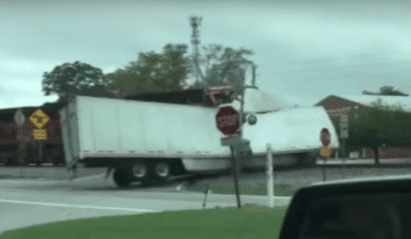WATCH: Train plows through semi truck stuck on tracks