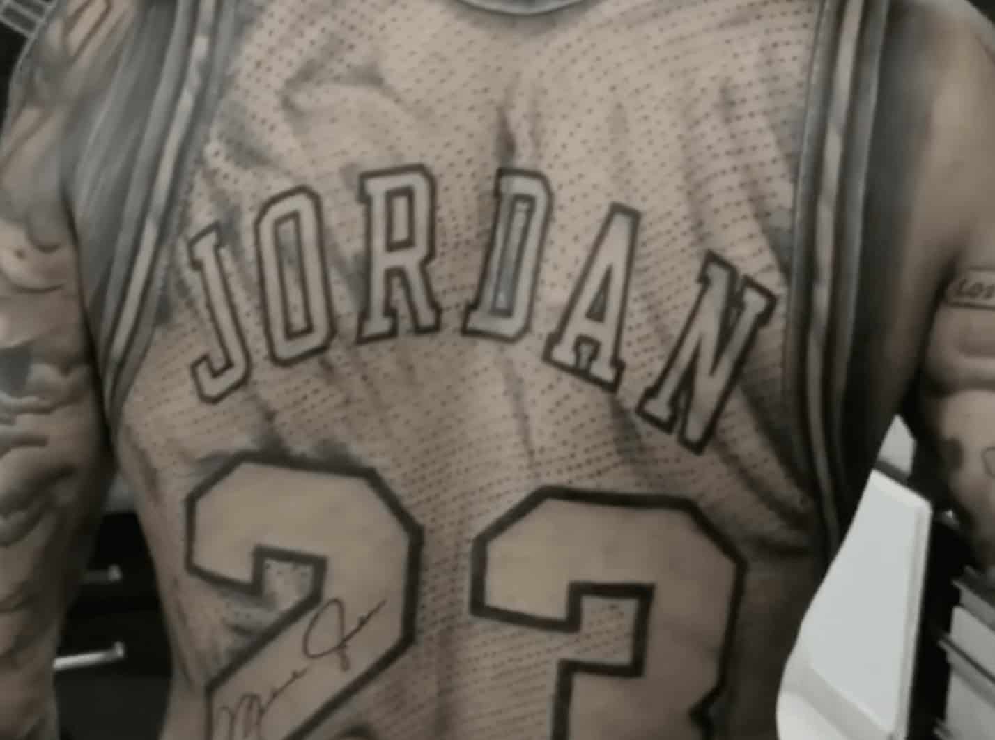 Fan gets Michael Jordan jersey tattoo on back!